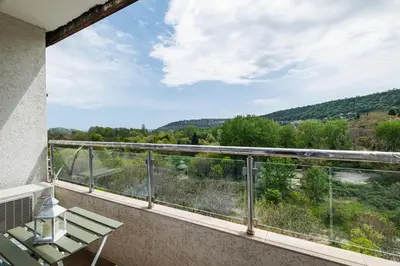 a balcony with a view of the mountains at Luxury apartment with sea view,FREE parking! in Varna City
