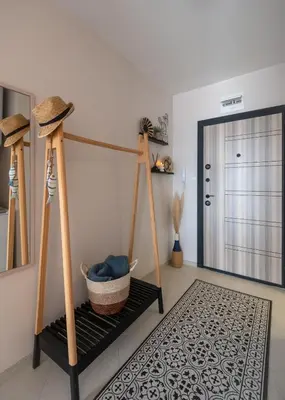 a room with twoadders and a basket on a shelf at Boho Apartment Sozopol in Sozopol