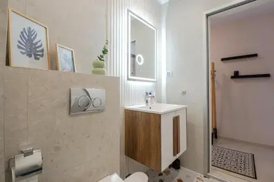 a bathroom with a sink and a mirror at Boho Apartment Sozopol in Sozopol