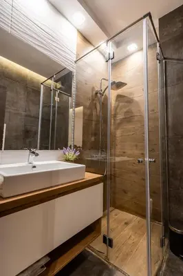 a bathroom with a sink and a shower at Spacious, free parking, 3min beach, Flora Panorama in Burgas City
