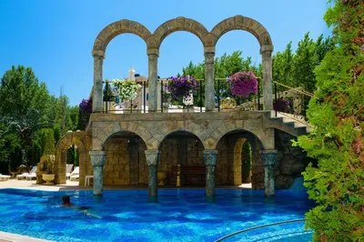 a house with a swimming pool with a balcony at Nemo's apartment - Sunny Beach in Sunny Beach