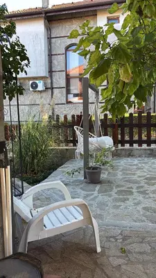 a white bench sitting on a patio in front of a house at Exklusive Villa am Sonnenstrand Bulgarien am Schwarzen Meer aheloy Cabernet 1 in Kableshkovo