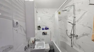 a white bathroom with a shower and a sink at Exklusive Villa am Sonnenstrand Bulgarien am Schwarzen Meer aheloy Cabernet 1 in Kableshkovo