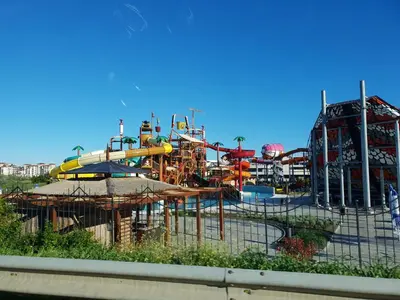 a water park with a water slide and a roller coaster at Double Peach Apartment in Sveti Vlas