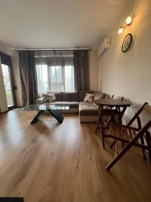 a living room with a couch and a table at Apartment Chocolate Ravda in Ravda