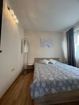 a bedroom with a bed and a window at Apartment Chocolate Ravda in Ravda