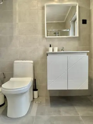 a bathroom with a white toilet and a mirror at Carina Beach - Private apartment - BSR - 1 in Sunny Beach