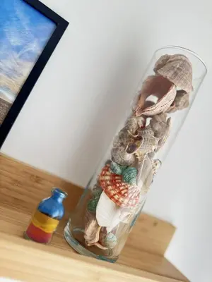 a glass jar filled with shells and a bottle at Urban Oasis in Varna City