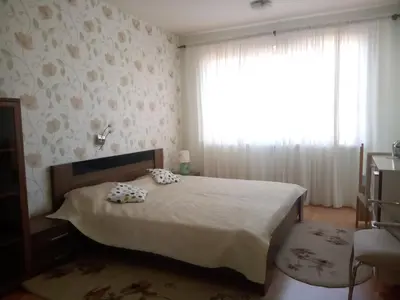 a bedroom with a bed with two pillows on it at Splendid sunny seasons in Byala