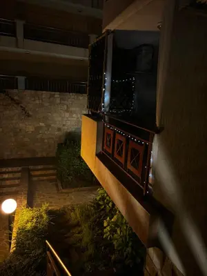 a balcony with a light on the side of a building at Apartment in complex Sirena! in Sveti Vlas