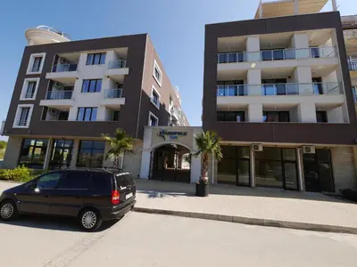 a car parked in front of a building at APART-HOTEL Stamopolu Lux с изглед към морето in Primorsko