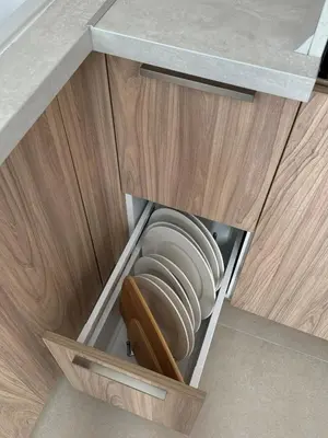 a cupboard with a bowl and a plate in it at Heart of Varna, Close to the Sea in Varna City