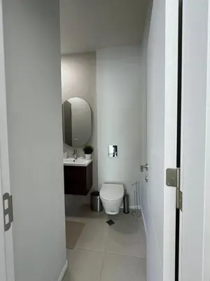 a bathroom with a white toilet and a sink at Heart of Varna, Close to the Sea in Varna City