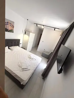 a bedroom with a white bed in a room at Hotel 415 in Sunny Beach