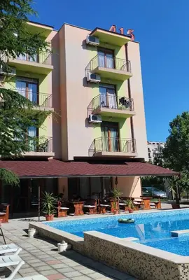 a hotel with a swimming pool in front of a building at Hotel 415 in Sunny Beach