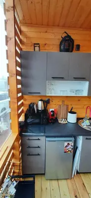 a kitchen with a stove in a cabin at Бунгало Шангри Ла-3, плаж Градина in Sozopol
