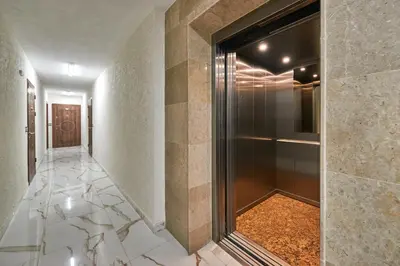 a hallway with a walk in shower and a door at АПАРТАМЕНТИ Радина in Pomorie
