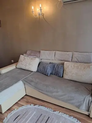 a large couch sitting in a room at Apartament in Aheloy in Aheloy