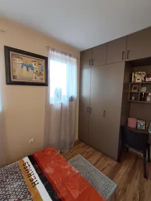a bedroom with a bed and a window at Apartament in Aheloy in Aheloy