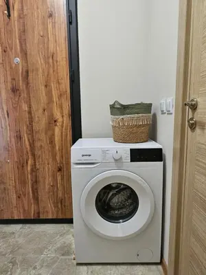 a washing machine with a basket on top of it at Релакс в Равда! in Ravda