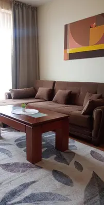 a living room with a couch and a coffee table at Garden of Eden in Sveti Vlas
