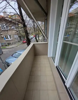 an empty balcony with a view of a street at Seaside Apartment in Varna City