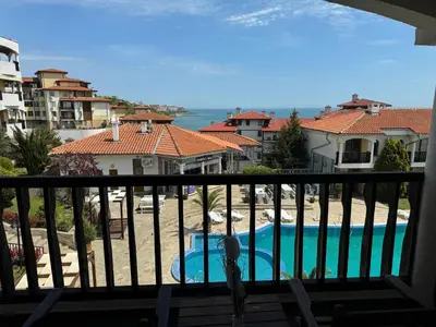 a view of a swimming pool from a balcony at Sun Coast by the Sea in Sveti Vlas
