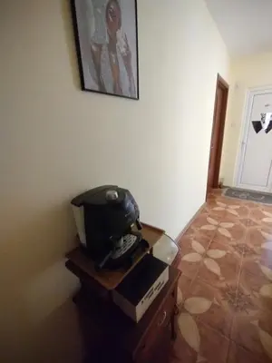 a room with a table with a helmet on top of it at Къща за гости Ками in Byala