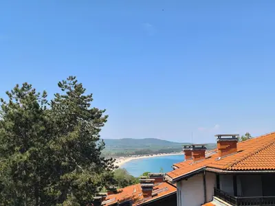 a view of the beach from the roof of a building at Lavender Apartment in Sozopol
