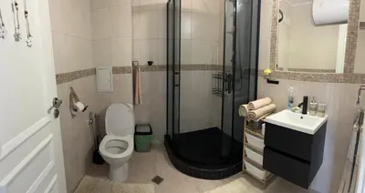 a bathroom with a shower and a toilet and a sink at Casa del Sol in Sunny Beach