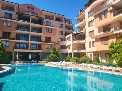 a swimming pool in front of a building at Efir Sunny beach holiday apartment in Sunny Beach