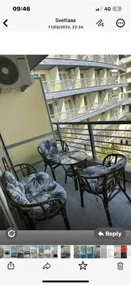 three chairs on a balcony in a building at Дрийм 2 Мечта 2 in Sunny Beach