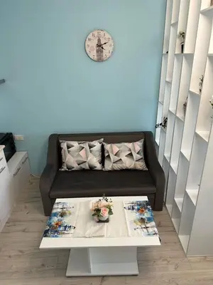 a living room with a couch and a table at Дрийм 2 Мечта 2 in Sunny Beach