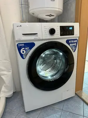 a washing machine sitting in a room at Nana Studio Sunny Beach in Sunny Beach