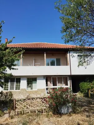 an old house with a red roof at Kasndra in Byala