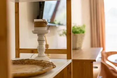 a table with a candle on top of it at Sunny apartment in the center of Varna for 5Guests in Varna City