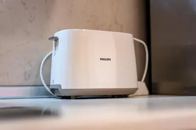 a white toaster sitting on top of a counter at Sunny apartment in the center of Varna for 5Guests in Varna City