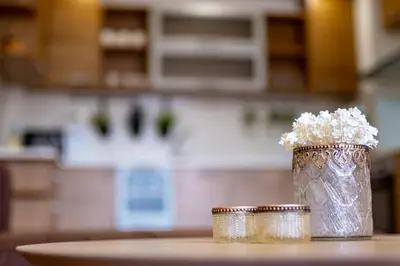 a vase filled with flowers sitting on a table at Sunny apartment in the center of Varna for 5Guests in Varna City