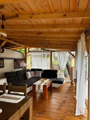 a living room with a couch and a table at Нереида in Sozopol