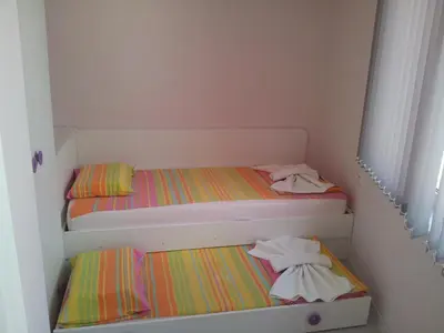two bunk beds in a small room with at Apartment Zlatina in Pomorie
