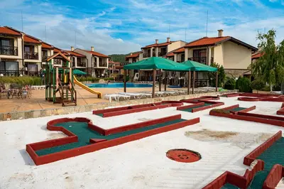 a swimming pool with a playground and a slide at Menada Imperial Heights Apartments in Sunny Beach