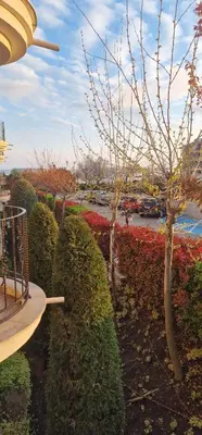 a garden with bushes and trees in a park at Premier Fort Beach Hotel in Sveti Vlas