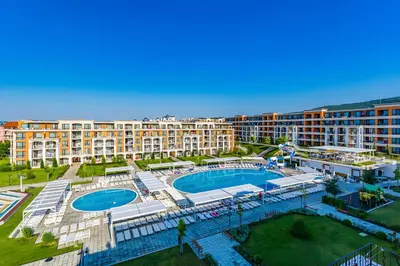 an aerial view of a resort with a swimming pool at Premier Fort Beach Apartment with Pool & Sea View in Sveti Vlas
