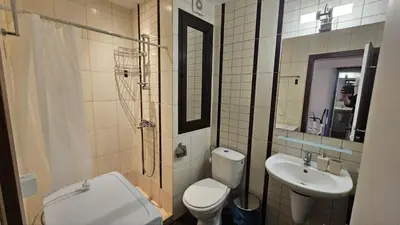 a bathroom with a toilet and a sink at Vladan apartments in Sozopol