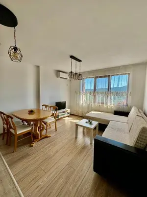 a living room with a couch and a table at Елскер in Tsarevo
