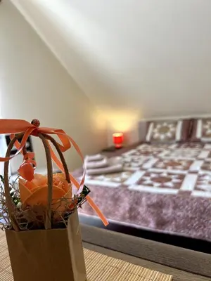 a room with a bed and a bag of oranges at Морска Идилия in Burgas City