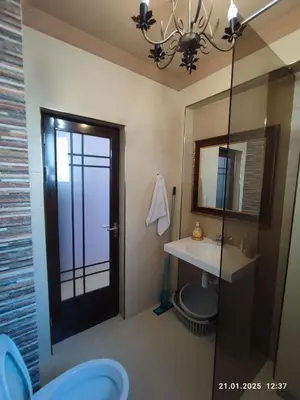 a bathroom with a sink and a mirror at Central View Burgas in Burgas City