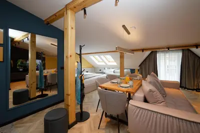 a living room with a couch and a table at Tsaribrod Design Apartments in Varna City