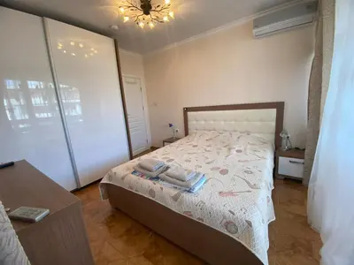 a bedroom with a bed with two towels on it at Robinzon Beach 3BD Lux apartment by Flat Mаnager in Elenite