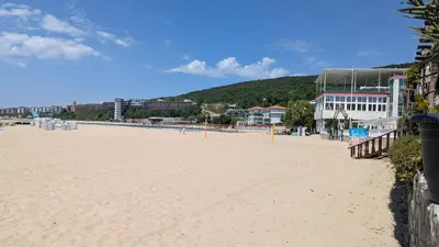 a view of a beach with buildings in the background at Robinzon Beach 3BD Lux apartment by Flat Mаnager in Elenite
